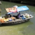 Photo suivante : Marchand ambulant dans la baie d'Halong