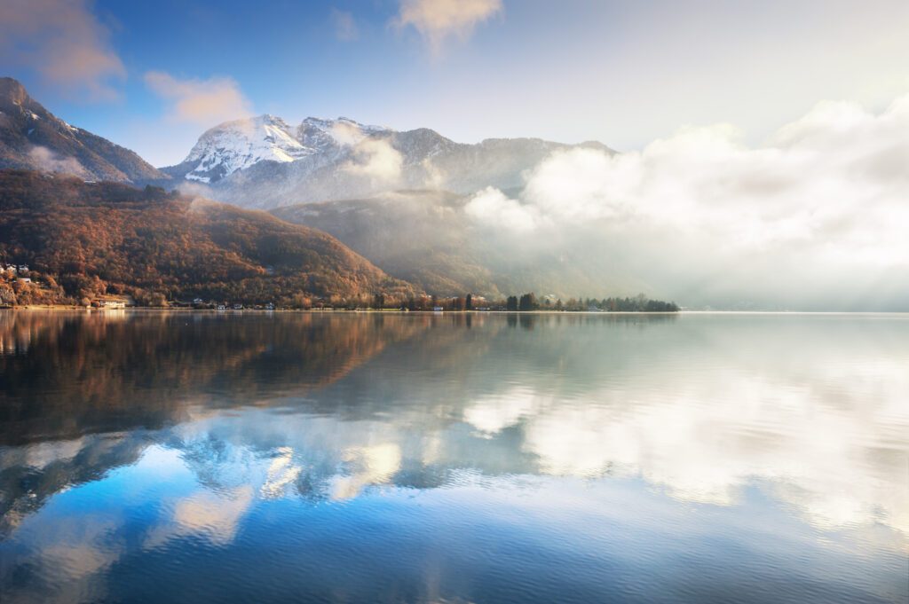 Annecy lake in French Alps at sunrise.