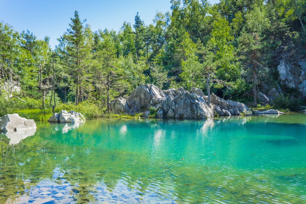 The Blue Lake (Lac bleu) in Champclause, Auvergne (France) is an old quarry that was flooded and is now a magnificent full of fished and with turquoise waters