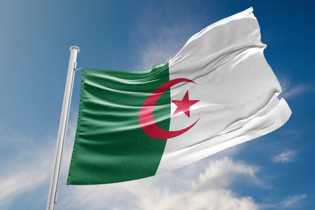 Algerian Flag is Waving Against Blue Sky