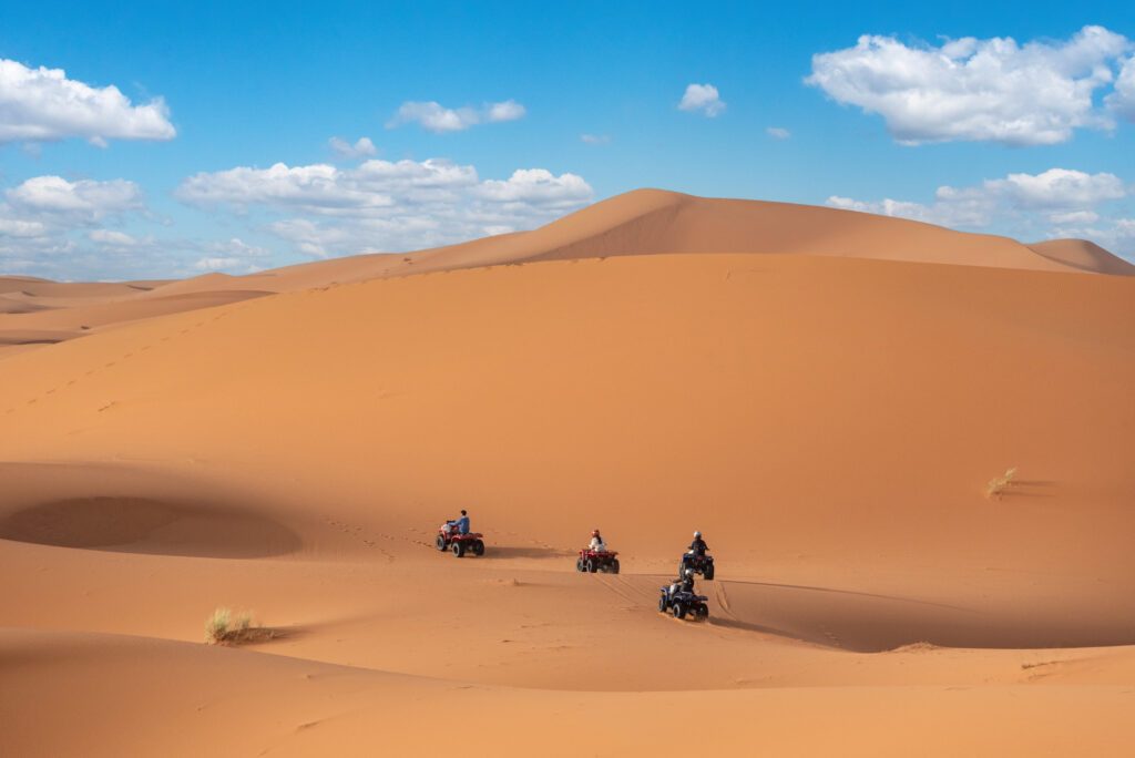Motor quads driving off-road in the Erg Chebbi desert near Merzouga