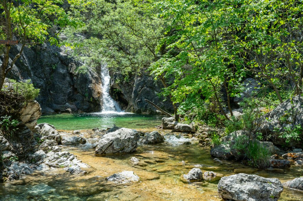 Orlias Waterfall with a green pool at Mount Olympus in Greece