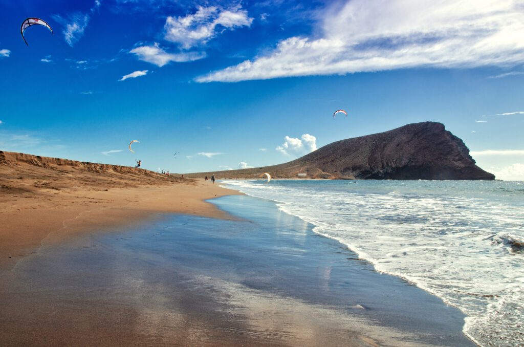 Playa de la Tejita. Kite surfers on Tenerife ocean beach. Tenerife Canary islands, Spain