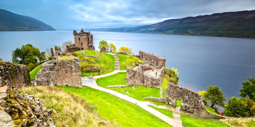 Urquhart Castle with Dark Cloud Sky and Loch Ness in the Background