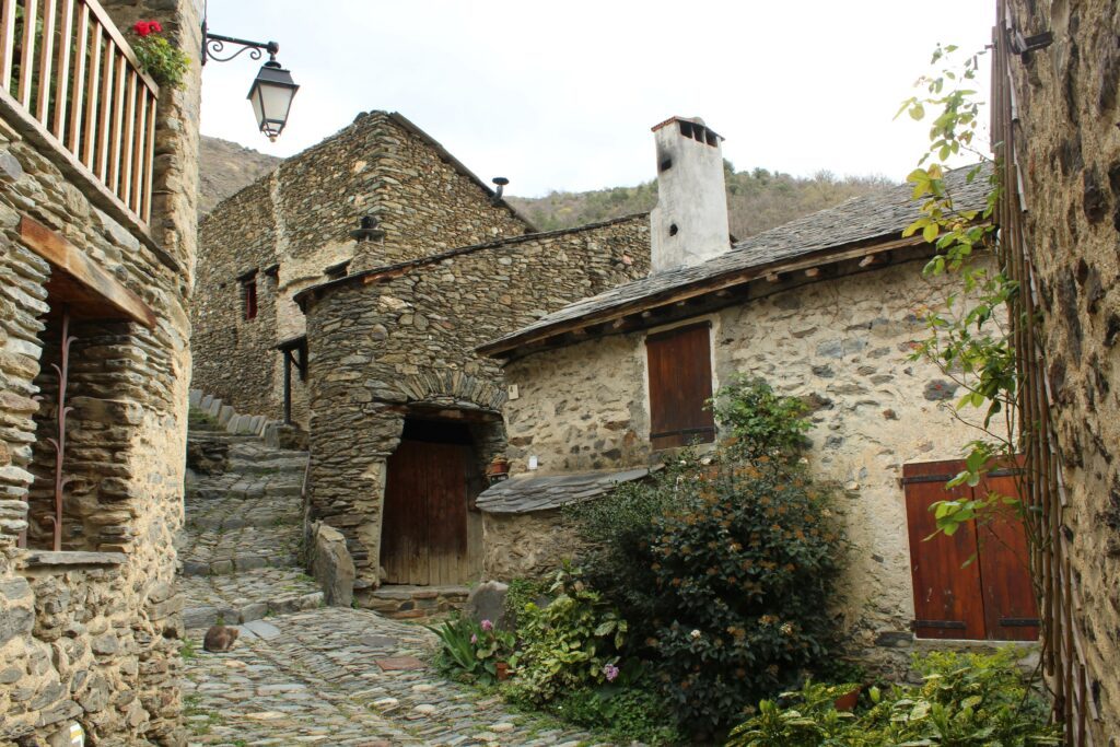 Evol, a picturesque village in Pyrenees-Orientales Department, southern France featuring houses built of schist with thackstone roofs
