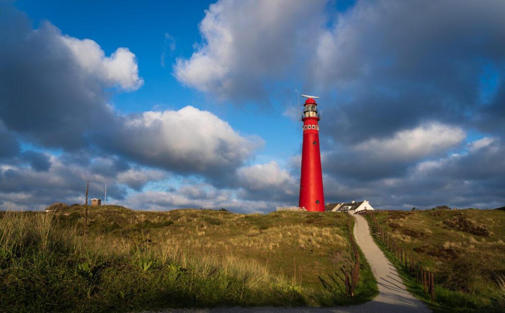 Lighthouse and clouds in the evening sun on the island of Schiermonnikoog.