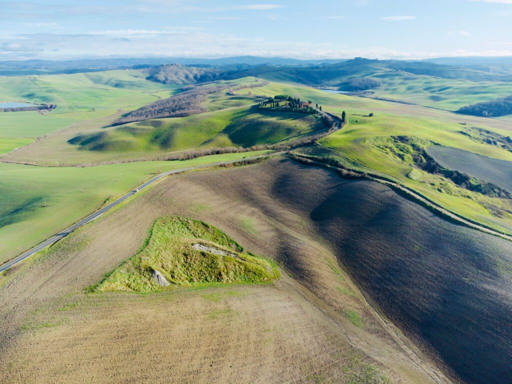 Siena, Tuscany- April 10 2021: aerial view of the hills and lakes of the province of Siena in the Crete Senesi in spring