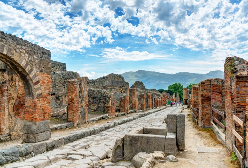 Ancient street in Pompeii, Italy. Roman ruins of famous city near Naples.