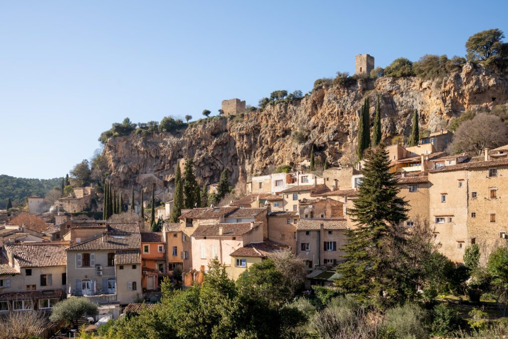 Cotignac is a French village in Provence. It is famous for its troglodyte dwellings that are carved into tufa cliffs covered with large stalactites, and its two feudal towers from 1033.