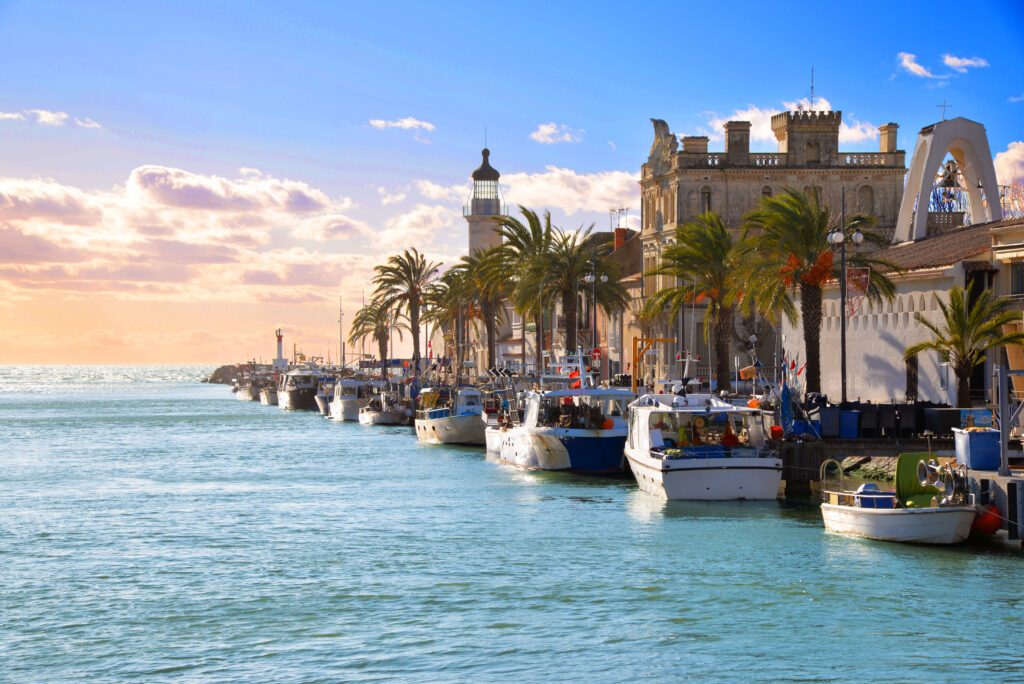 Lighthouse and old fishing port of Grau du roi in Camargue zoological nature reserve. South of France.