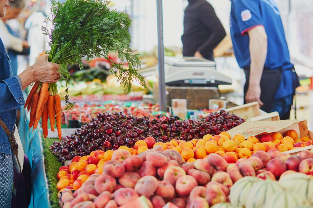 Fresh organic vegetables and fruits on farmer market in Paris, France