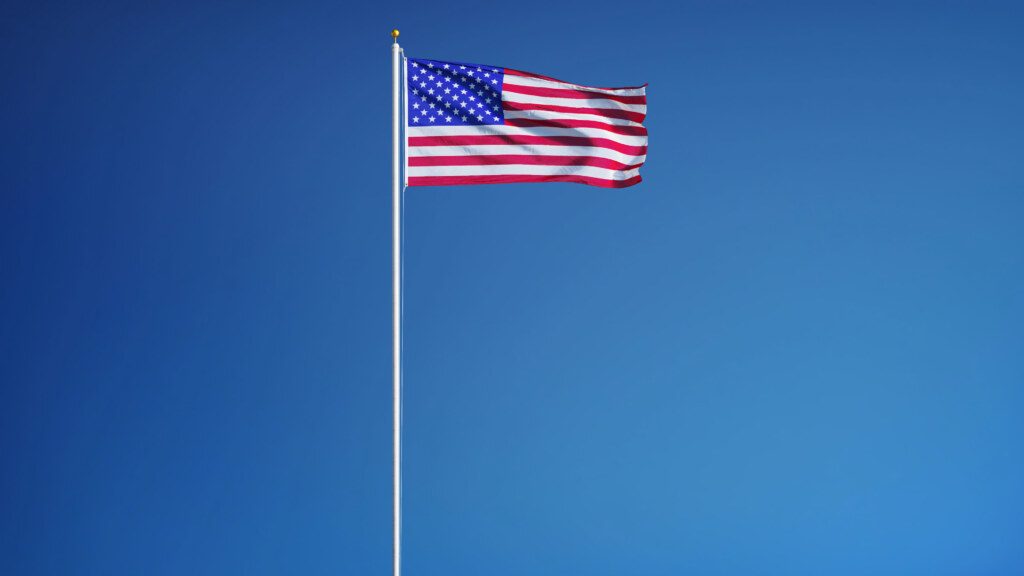 USA flag waving against clean blue sky, long shot, isolated with clipping path mask alpha channel transparency