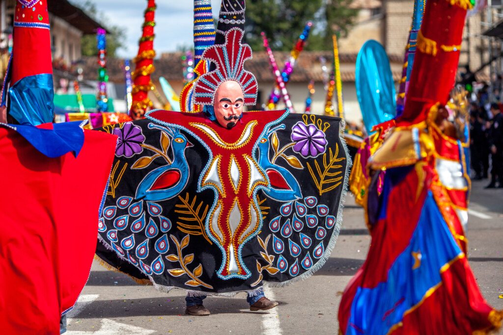 Carnival of Cajamarca, parade of multicolored and traditional costumes. Cajamarca, Peru.