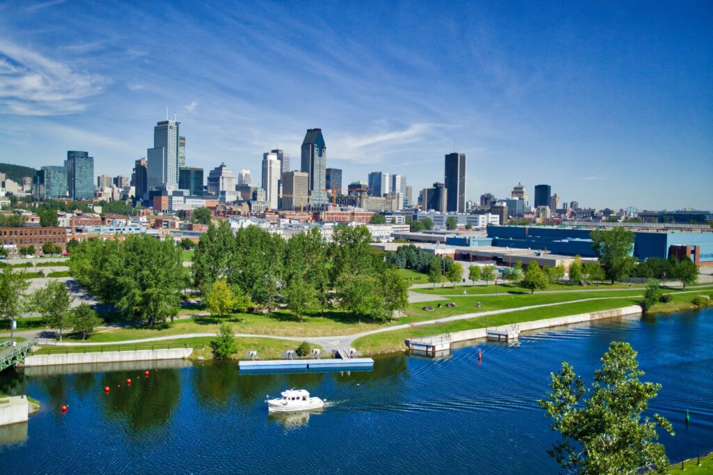 Montreal skyline with yacht in foreground in the Lachine Canal