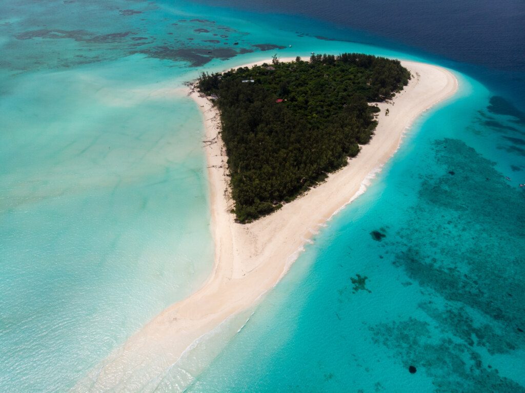 Aerial view of Picturesque Mnemba Atoll in Zanzibar - The Famous Spot for Snorkeling and Boat Tour