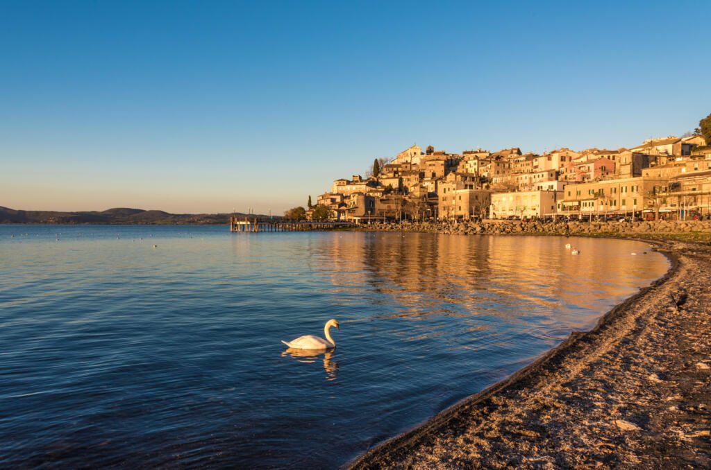 Anguillara Sabazia, Italy - The Bracciano lake at sunset from the old stone town on the waterfront named Anguillara Sabazia, province of Rome, central italy