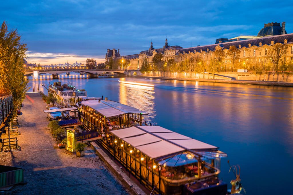 Peniche boats in Paris at night