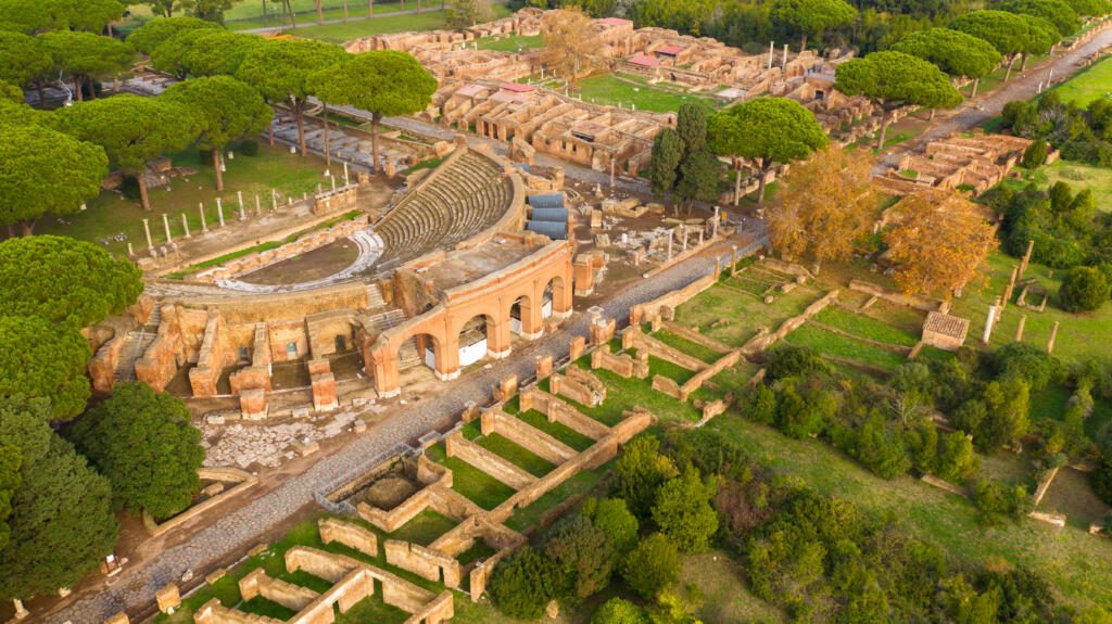 Aerial view on the Roman theatre of Ostia Antica, a large archaeological site, close to the modern town of Ostia. The ancient Roman Amphitheater is located in Rome, Italy.