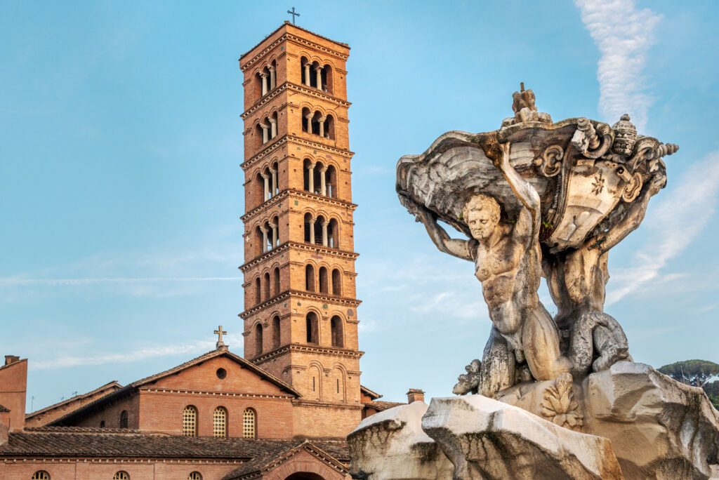 Fountain of Tritons and church Santa Maria in Cosmedin in Rome, Italy