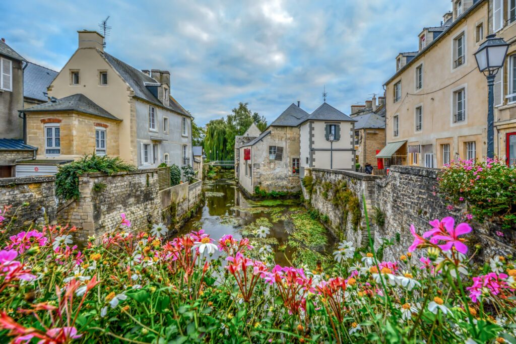 The picturesque French town of Bayeux France near the coast of Normandy with it's medieval houses overlooking the River Aure on an overcast day