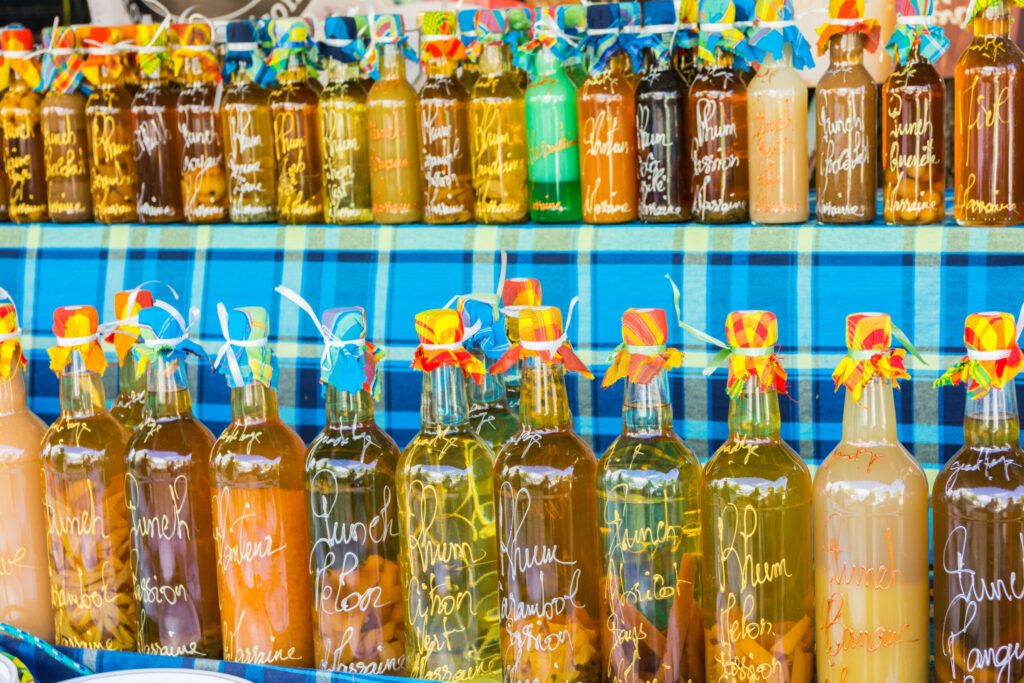 Arranged rum bottles on a local market in Sainte-Anne, Grande-Terre, Guadeloupe