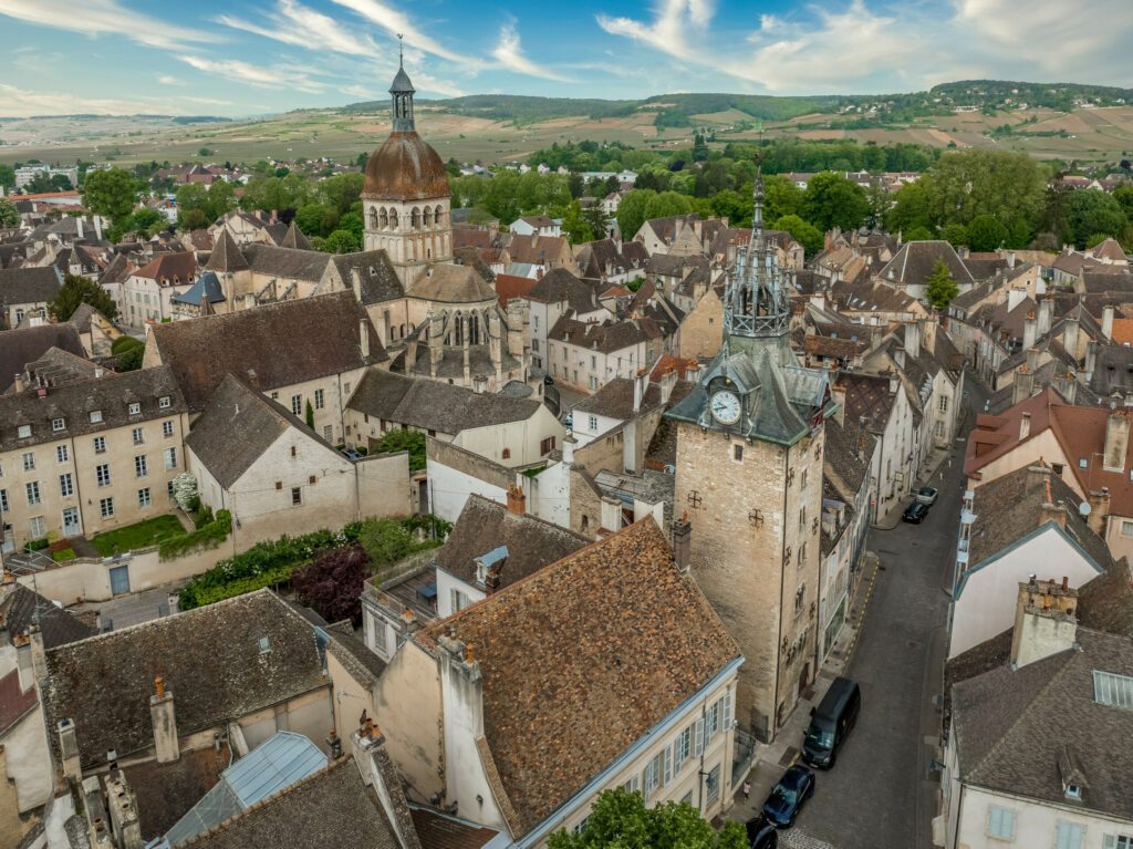 Aerial view of Beaune walled old town center, wine capital of Burgundy with battlements, bastions, Beffroi clock tower collegiate church of Notre Dame