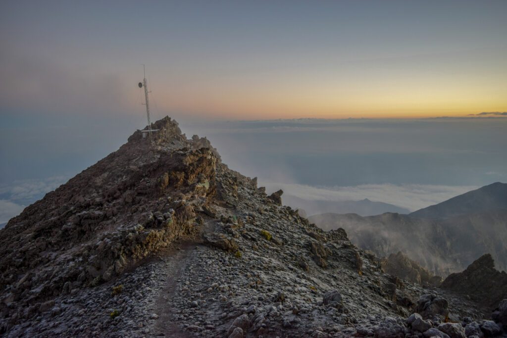 Golden sunrise above the clouds at Mount Meru, Tanzania