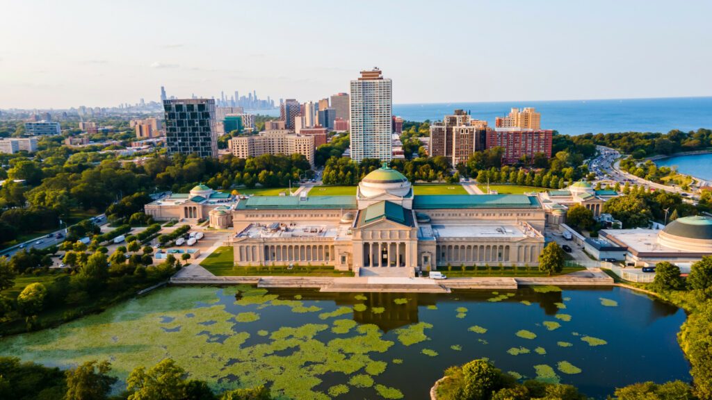 Chicago, IL USA September 16th 2022: Aerial drone footage of the Chicago Museum of Science and industry during the summer time. the view from above is beautiful with the lake water full of life