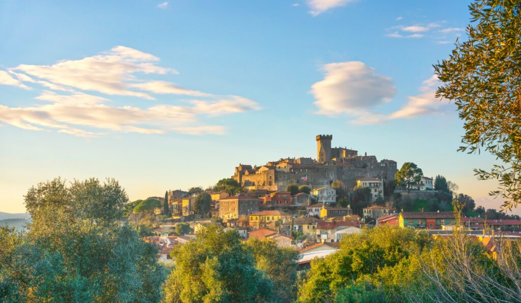 Capalbio medieval village skyline at sunset. Maremma, Tuscany Italy