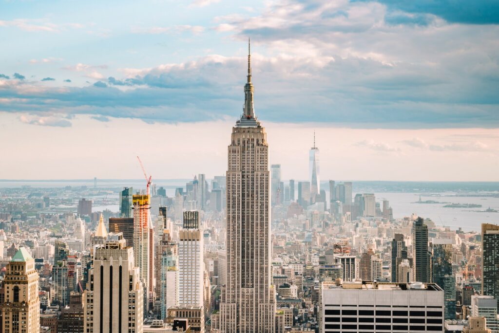 Close up view of the Empire State Building and the New York city skyline on a beautiful blue sky day