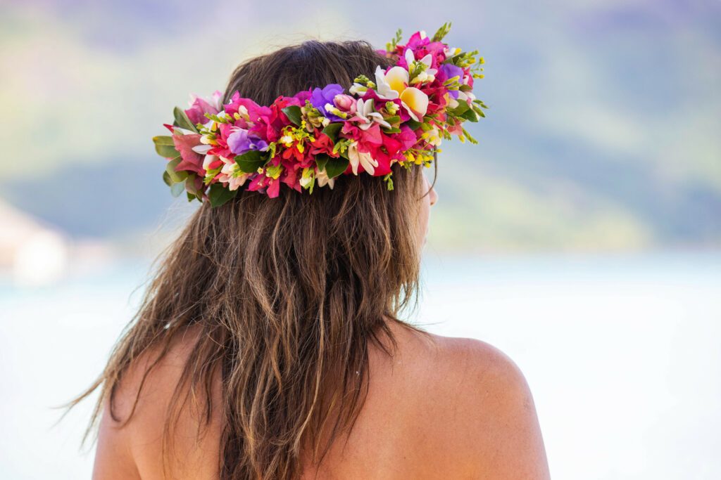 Woman wearing colorful flower crown in Tahiti