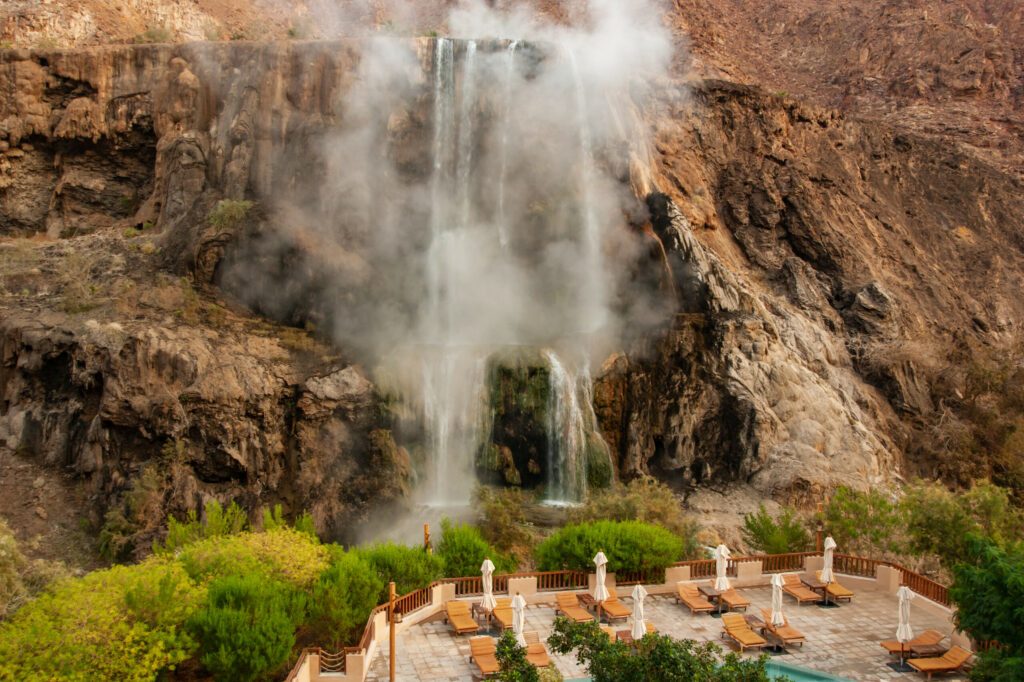 Ma'in - hot springs. The oldest resort in Jordan. View from the spa hotel to mountain waterfalls with hot water and steam. Ma'in, Jordan - December 08, 2009