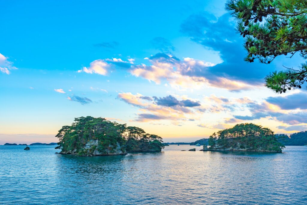 Matsushima Bay in dusk, beautiful islands covered with pine trees and rocks. One of the Three Views of Japan, and is also the site of the Zuigan-ji, Entsu-in and Kanrantei. in Miyagi Prefecture, Japan