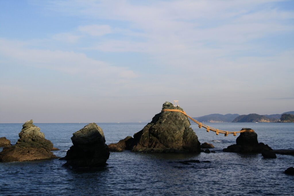 Meoto Iwa, or the Married Couple Rocks, are a couple of small rocky stacks in the sea off Futami, Mie Prefecture, Japan.