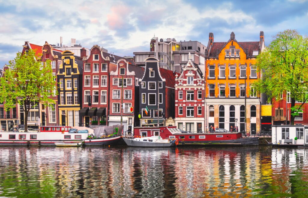 Amsterdam Netherlands dancing houses over river Amstel landmark