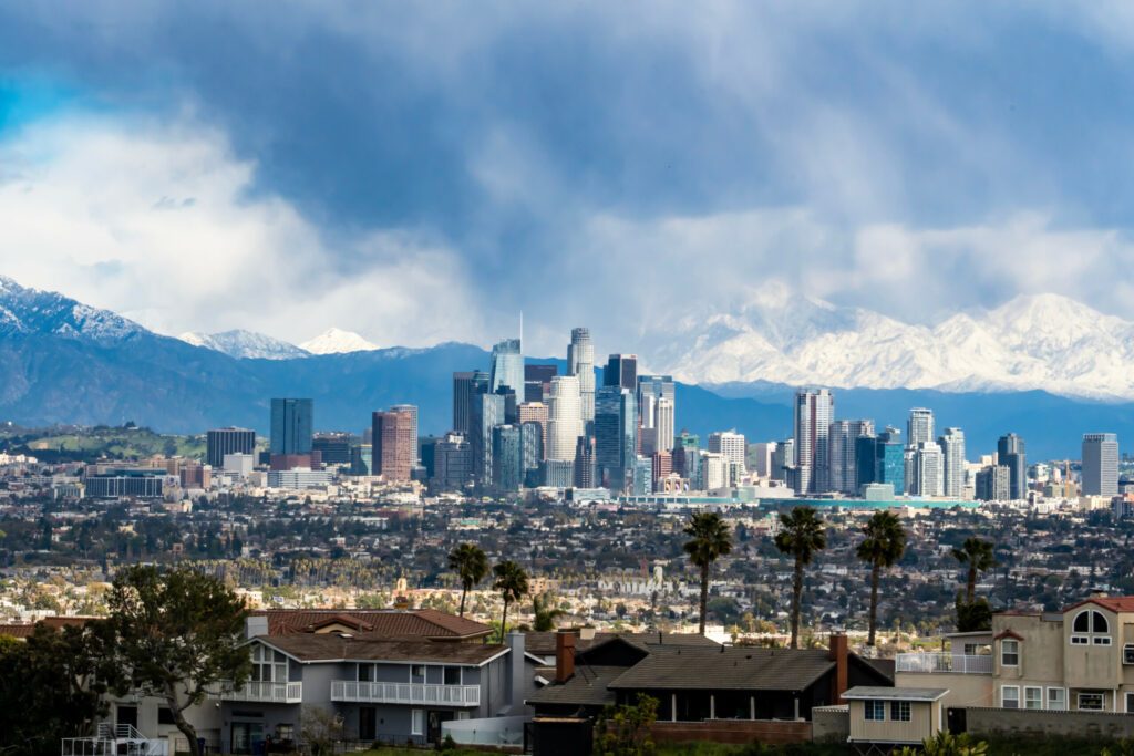 Downtown Los Angeles, CA Skyline with Snowy Mountains