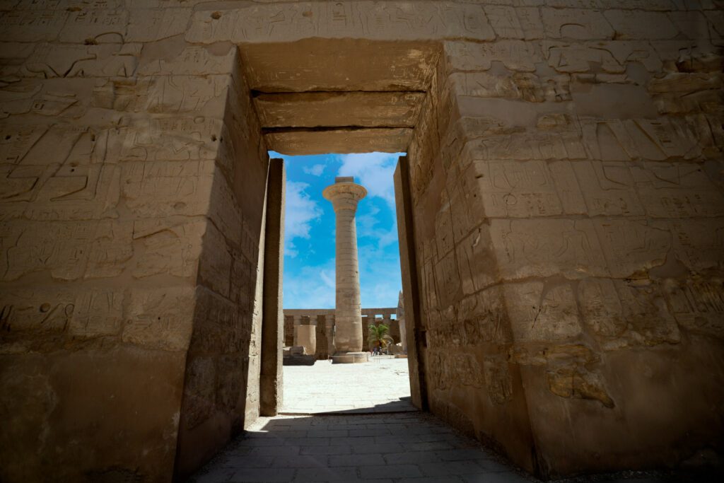 The remaining column of the Kiosk of Taharqa framed by the door entrance of Amun Temple at the Karnak Temple Complex. Luxor .Egypt .