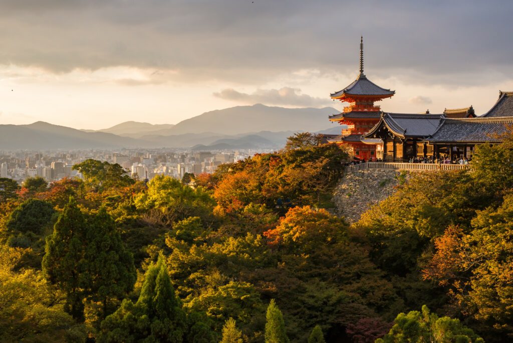 Kiyomizu-dera temple in Kyoto, Japan, in beautiful autumn colors, evening light and view of the city