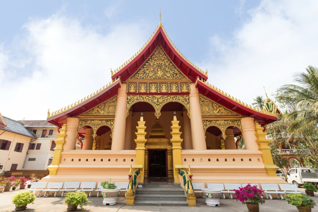 Wat Ong Teu Mahawihan (Temple of the Heavy Buddha), a Buddhist monastery, in Vientiane, Laos, on a sunny day.