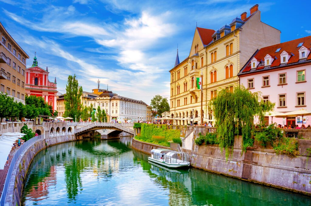 Slovenia Ljubljana Tromostovje Ljublianica river Church