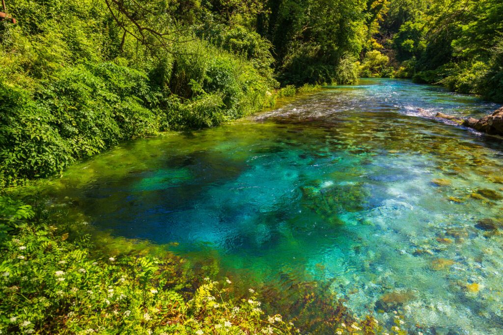 Turquoise spring Blue Eye - Syri i Kalter, near a town of Muzine, Albania. The spring is very powerful, cold and deep and is a source of a river Bistrice