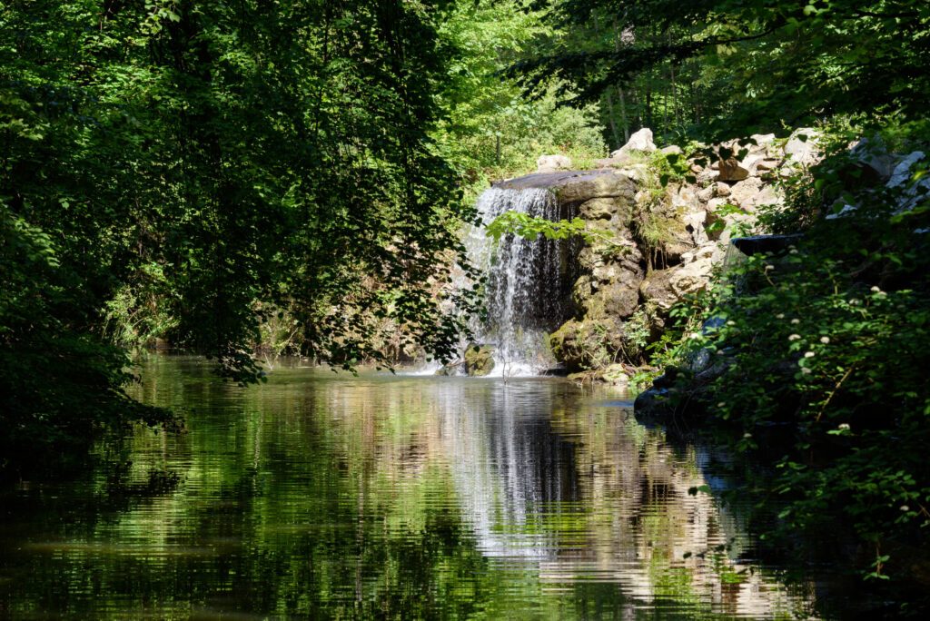 Small waterfall at the Lac des Minimes in The Bois de Vincennes located on the eastern edge of Paris, France.