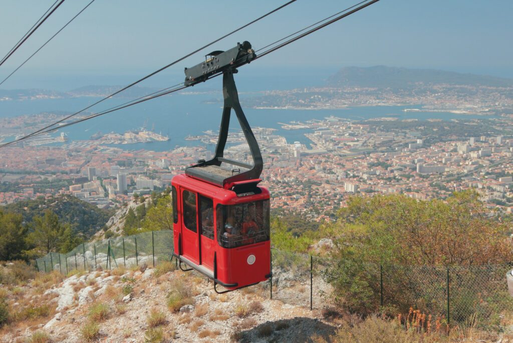 Cableway cabin over seaside city. Toulon, France