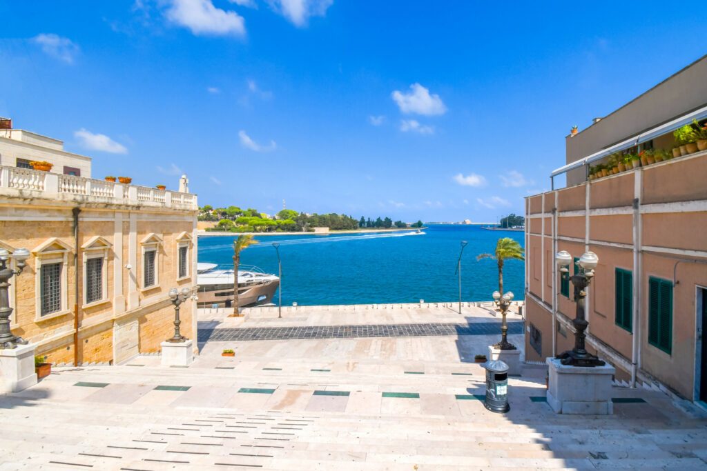 View of the Bay of Brindisi and waterfront promenade from the steps end of the Appian Way in Brindisi Italy