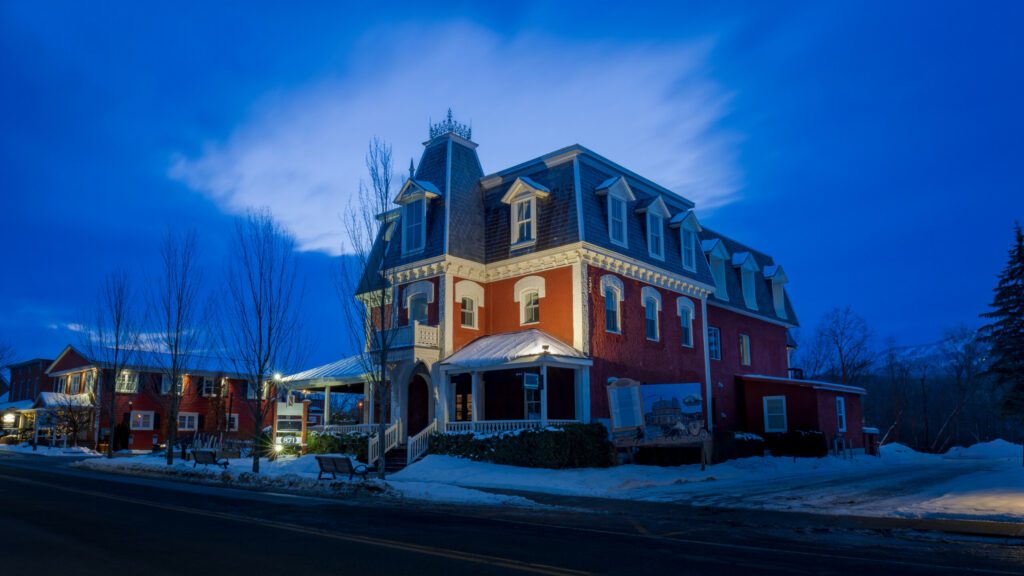 the main street of the city of Bromont with the Ski Mountain in the background. Eastern Townships, Quebec, Canada.