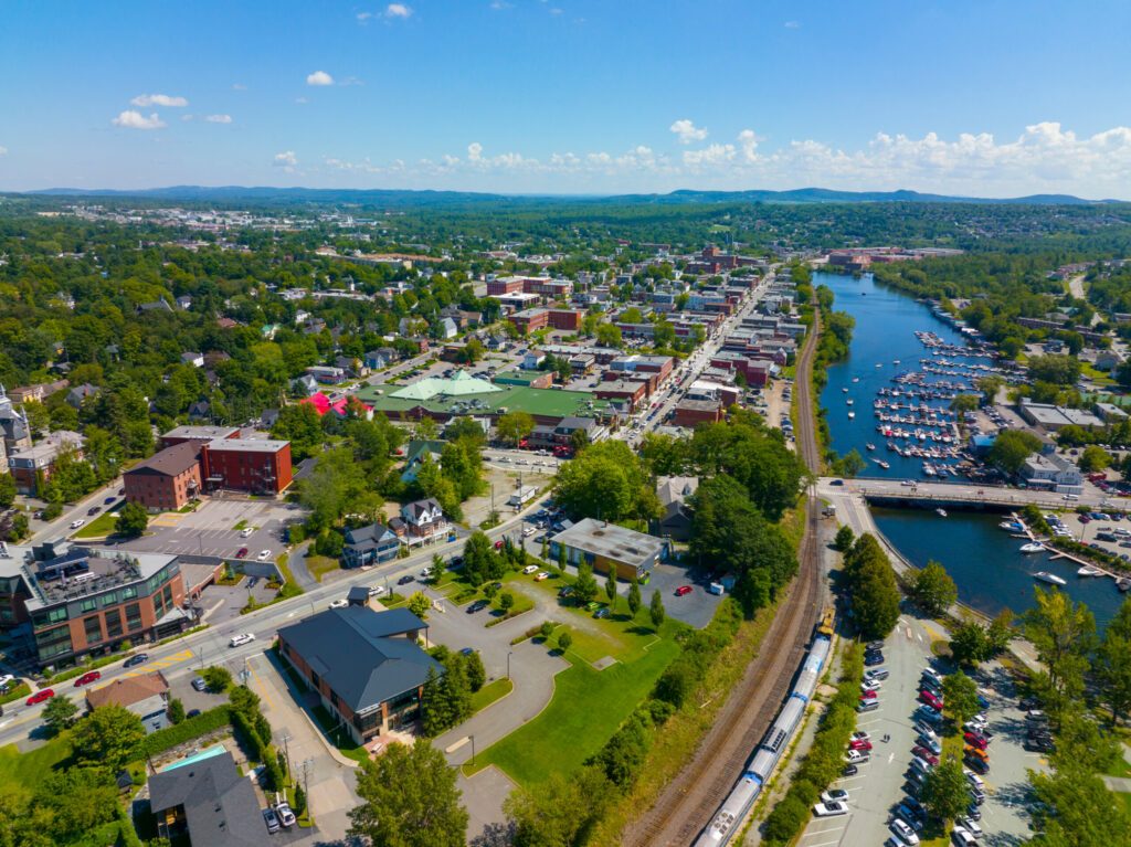 Magog city aerial view at the mouth of Magog River to Lake Memphremagog, Magog, Memphremagog County, Quebec QC, Canada.