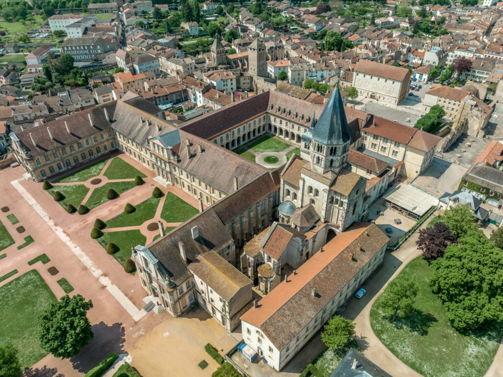 Aerial view of Cluny Abbey Benedictine monastery in Cluny, Saône-et-Loire, France. dedicated to Saint Peter, constructed in the Romanesque architectural style and Tour de Fromages