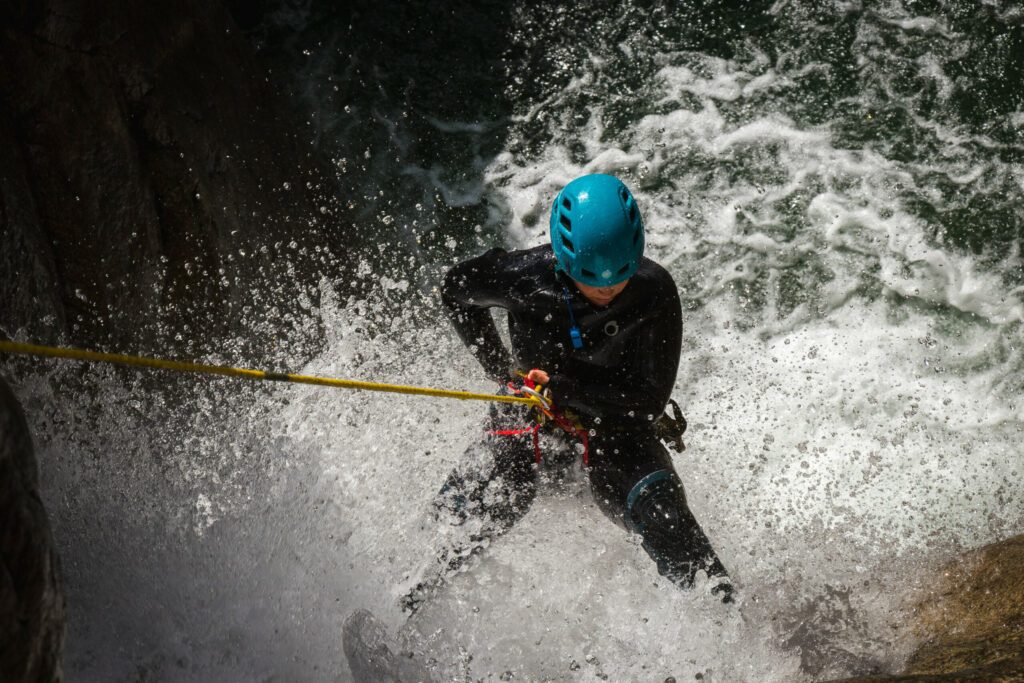 Rafter in a river with water splashes everywhere in Corsica, France