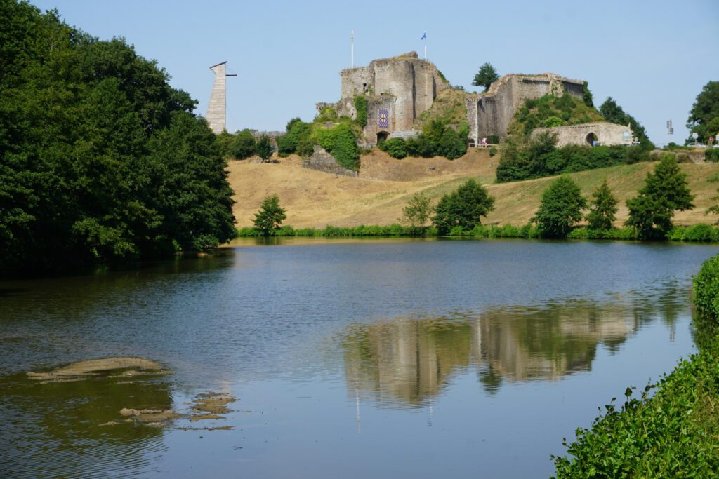 mirror reflection of the ruins of the medieval castle in the river of Tiffauges, Vendée, France