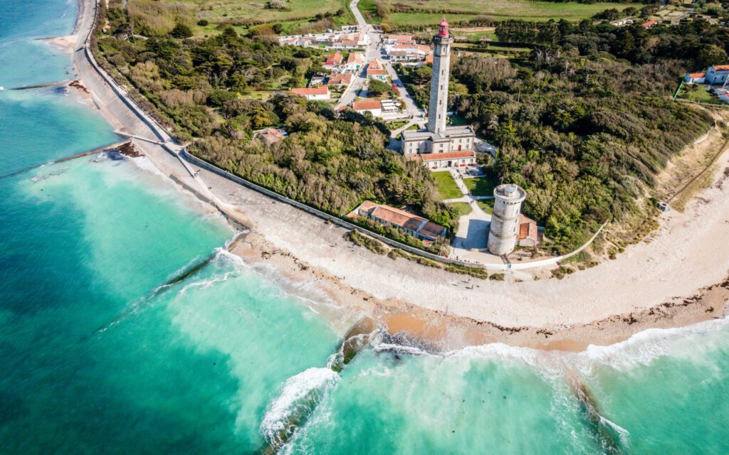 Aerial drone panorama shot of the Phare des Baleines or Lighthouse of the Whales taken from the sea on Ile de Ré or island of Re France